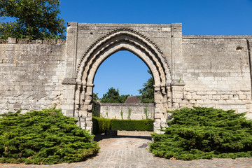Fototapeta na wymiar Gate by St Nicolas Abbey in Saint-Leu-d'Esserent