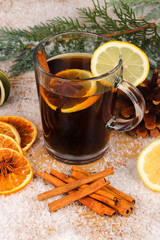 christmas tea or mulled wine on wooden table with snow  - christmas background