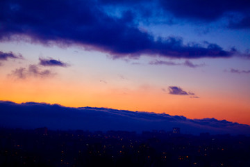 beautiful view on city in the evening and clouds 