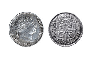 Old pre decimal 1819 George III silver sixpence coin with reverse showing the arms of the UK cut out and isolated on a white background