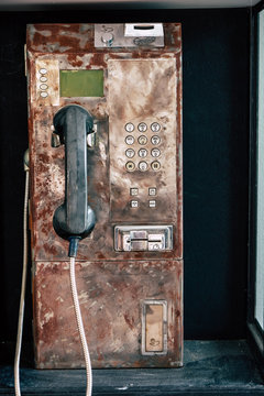 Close up Old Grungy Public Payphone
