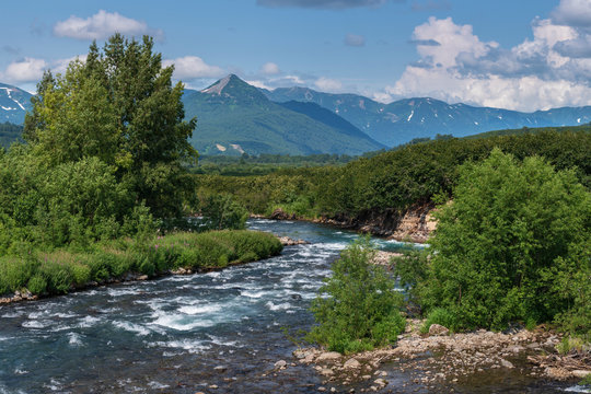 Stunning Summer Panorama Landscape Of Mountain River In Kamchatka Peninsula