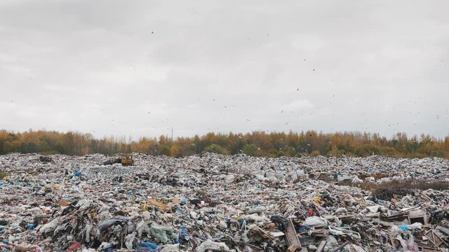 Handheld shot of city garbage dump, environmental pollution due to lack of recycling technology