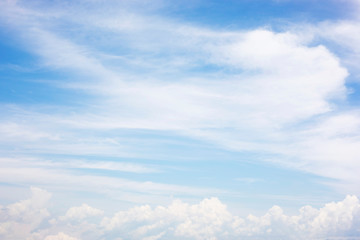 Obraz premium Blue sky background and white clouds soft focus, and copy space