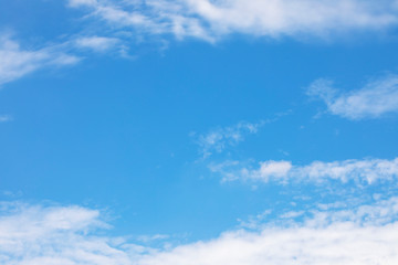 Blue sky background and white clouds soft focus, and copy space