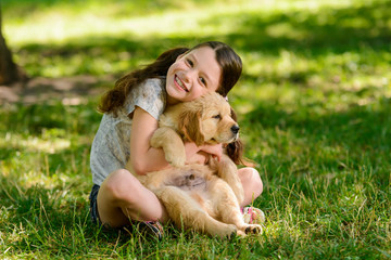 Girl playing with a dog