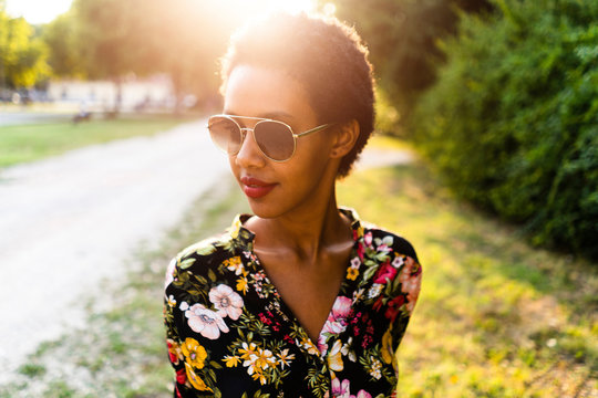 Fashionable young woman wearing sunglasses outdoors