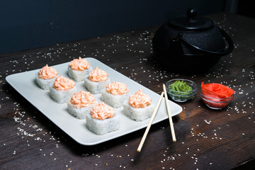 japanese rolls served on plate on wood table
