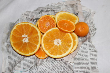 Mandarin and orange on Newspapers background orange juicy tasty vitamin healthy
