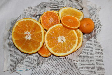 Mandarin and orange on Newspapers background orange juicy tasty vitamin healthy