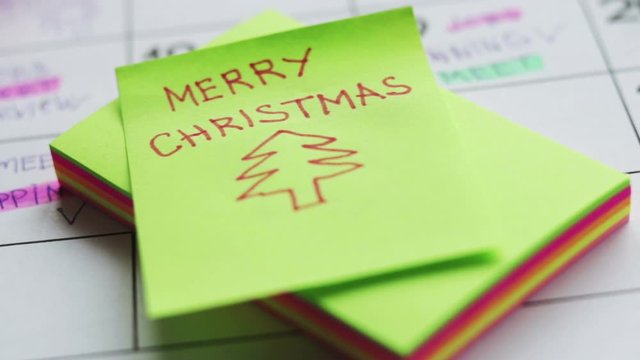 merry christmas tree drawing on sticker note  paper soft focus footage