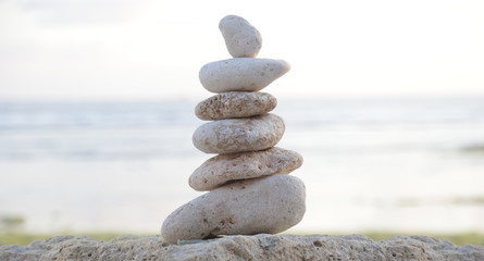 
Balanced Zen stones on blurred beach background, concept of balance and harmony