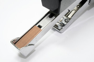 Office stapler filled with staples isolated on white background