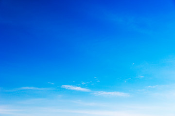 Blue sky background and white clouds soft focus, and copy space