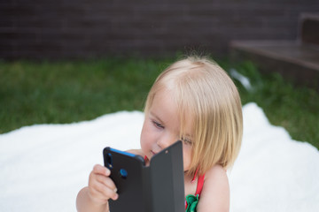Fabulous communication ability. Small girl with mobile phone. Girl child with blond hair talk on cell phone. New technology for children. Small child make phone call. My hair my look
