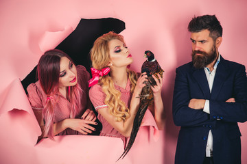 Vegetarian. Crazy couple on pink. Halloween. Creative idea. Bird flu. Funny advertising. vintage people with poultry meat. Poaching. retro happy women and man hold pheasant. Crazy advertising