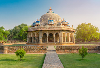 Dramatic view of Isa Khan Niyazi's tomb this octagonal tomb known for its sunken garden was built for a noble in the Humayun's Tomb complex with ray sunset. Historical Landmark of Delhi, India