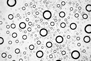 white isolated background water drops on the glass / wet window glass with splashes and drops of water and lime, texture autumn background