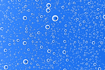 fresh drops background blue glass / wet rainy background, water drops transparent glass blue