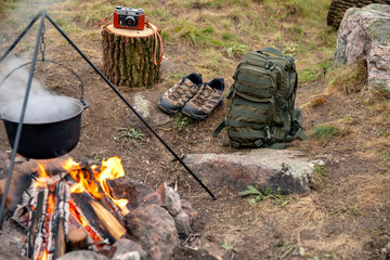 Cooking on a fire. Fish soup on a fire. Food in a cauldron on a fire. Food outdoors. Cooking...