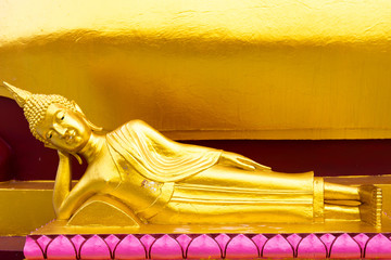 Ancient golden reclining buddha at Big Buddha Temple is a famous tourist destination of Koh Samui...
