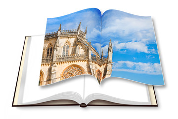 Detail of the facade of Batalha cathedral in Portugal (Europe) on opened photobook