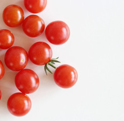 Fresh ripe red garden tomatoes on white wooden table. Food concept.
