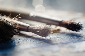 stained brush with the bristles lying on the palette
