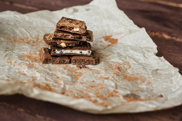 Dark chocolate bark with mixed fillingson wax paper