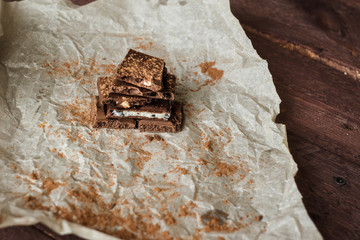 Dark chocolate bark with mixed fillingson wax paper