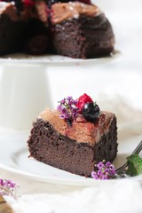 Homemade Chocolate Quinoa Cake topped with fruits and berries