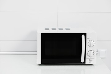 Modern kitchen interior with electric and microwave oven