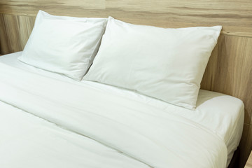 Fototapeta na wymiar White pillows on a bed Comfortable soft pillows on the bed