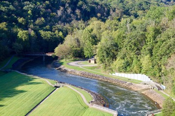 The winding flowing water in the valley of the countryside.