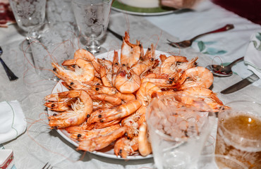 Plate of freshly cooked and appetizing prawns on a table ready for a celebration