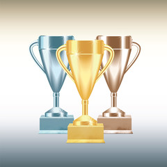 Set of golden, bronze and silver Trophy cups or goblets isolated on white background with gradients. Realistic Vector illustration