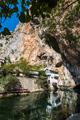 Fototapeta na wymiar Blagaj Tekke, Dervish House, in rocks at Buna river, Bosnia And Herzegovina