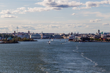 Fototapeta premium Helsinki city on summer with lots of smaller boats and a car ferry loading, Finland