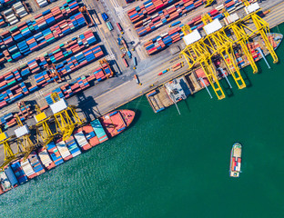 Aerial view of Deep seaport with cargo ships and containers