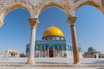 Ancient arch and Dome of the Rock Mosque in Jerusalem, Israel.