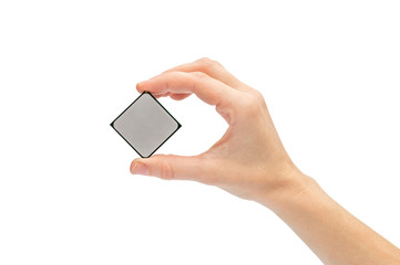 Woman's hand holding computer processor. Isolated on white.