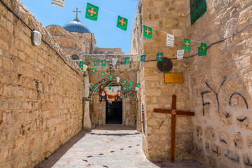The 9th station of the cross in Via Dolorosa at the entree to the Coptic Orthodox Patriarchate, Old City East Jerusalem, Israel.