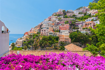 The lovely resort of Positano climbs up the Bougainvillea clad hillside of the Amalfi Coast, Italy. - 231195958