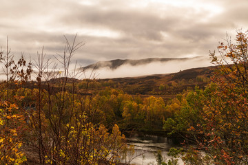An autumnal image of Shiehallion and the river Tummel in Perth and Kinross, Scotland.