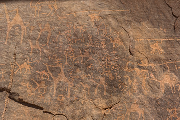 Prehistoric rock painting in the red sand desert Wadi Rum, Jordan.