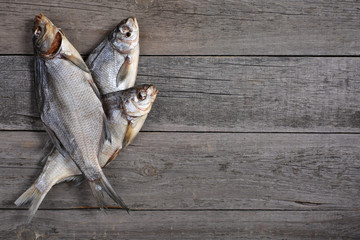 Dried fish on wooden background