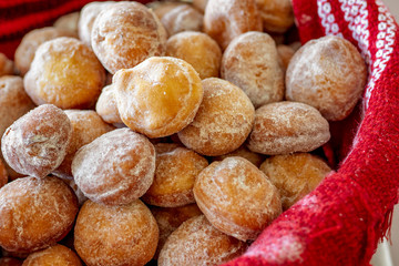 Homemade romanian doughnuts in a basket