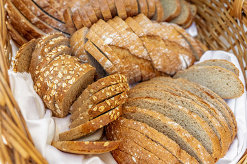 Fresh baked bread with seeds in a basket