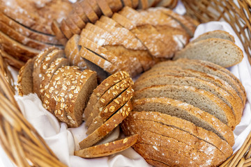 Fresh baked bread with seeds in a basket