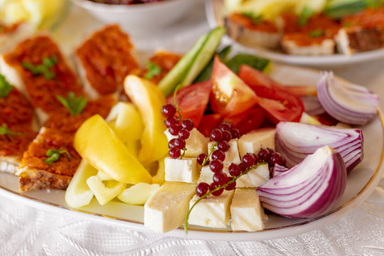 Traditional Romanian Food platter brunch with vegetables fresh onions and cheeses
